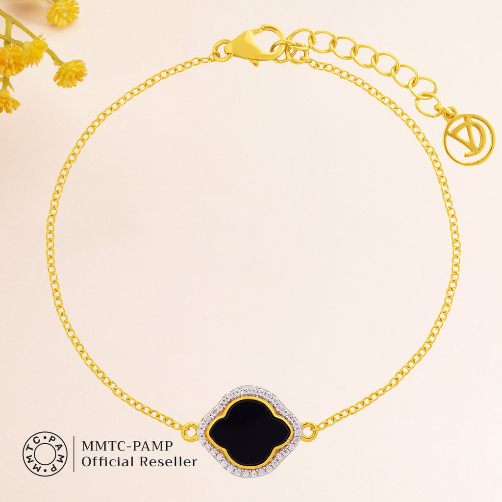 An image containing Celestial Elegance Onyx, Cubic Zirconia Bracelet, Pendant, Earrings, Chain & 10gm Silver Coin MMTC PAMP Gift Hamper.