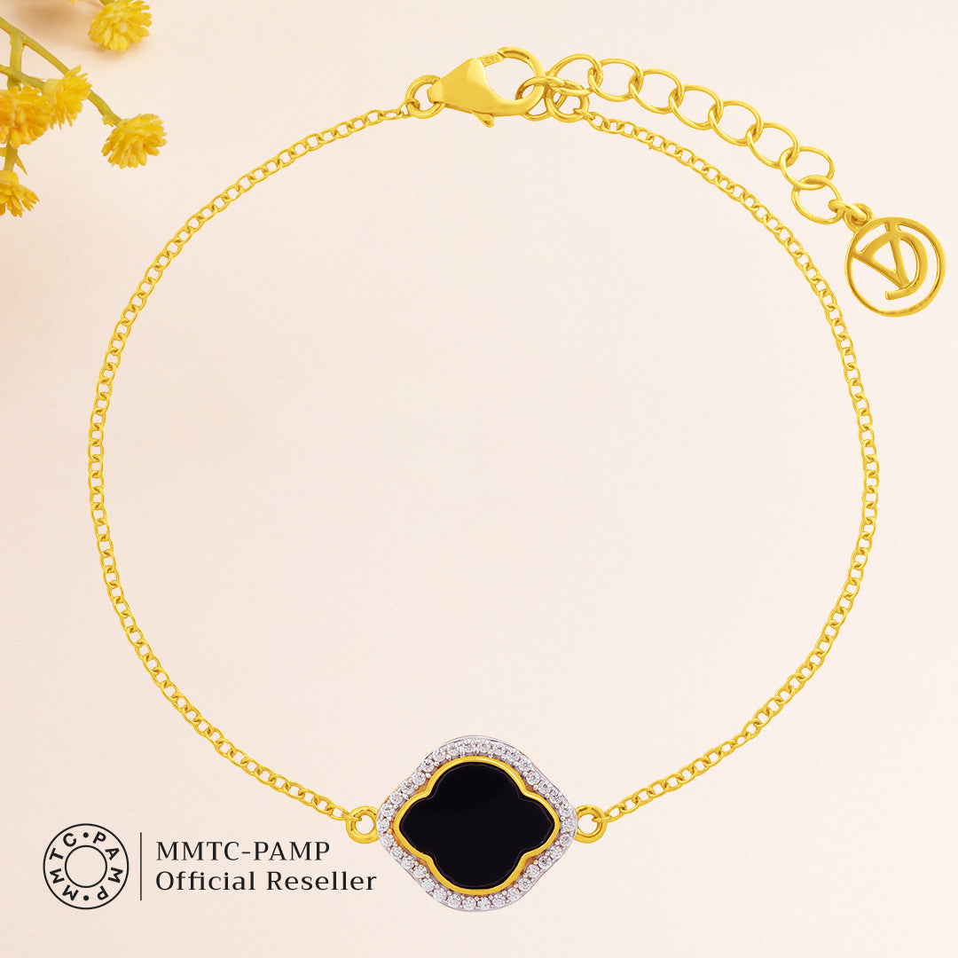 An image containing Celestial Elegance Onyx, Cubic Zirconia Bracelet, Pendant, Earrings, Chain & 10gm Silver Coin MMTC PAMP Gift Hamper.