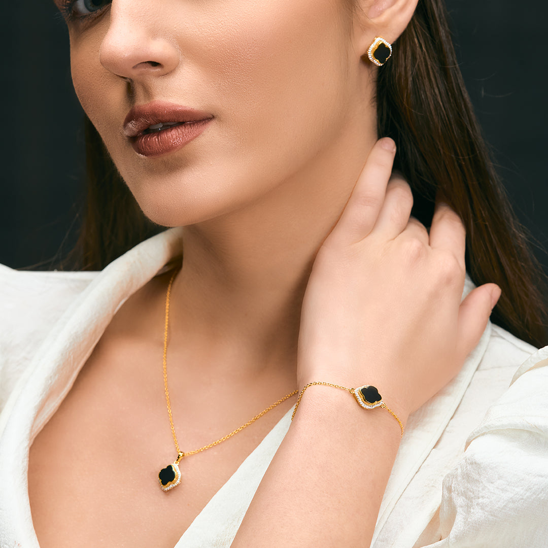 An image containing Celestial Elegance Onyx, Cubic Zirconia Bracelet, Pendant, Earrings, Chain & 10gm Silver Coin MMTC PAMP Gift Hamper.