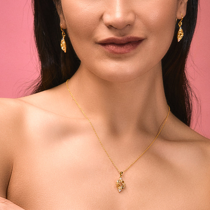 A woman wearing Cubic Zirconia Pendant adorned with Light Green Amethyst.