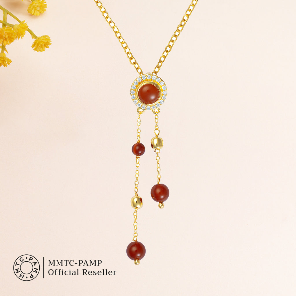 An image of Scarlet Sparkle Suite Red Onyx and Zircon Earring, Pendant, Bracelet with Golden Chain & 10gm Silver Bar MMTC PAMP Gift Hamper.