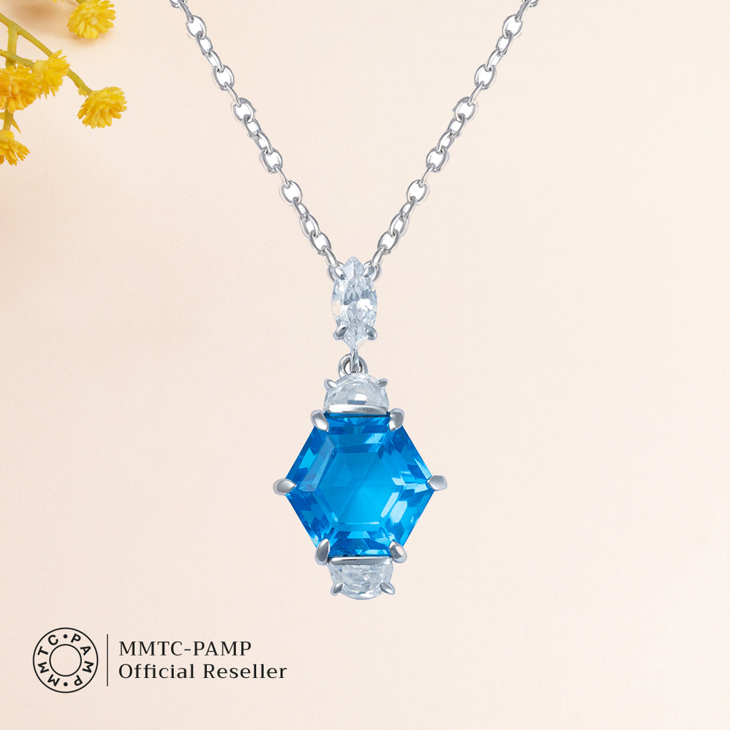 An image of Radiant Swiss Blue Gem Earrings, Pendant, Silver Chain With 10gm Silver Bar MMTC PAMP Gift Hamper.