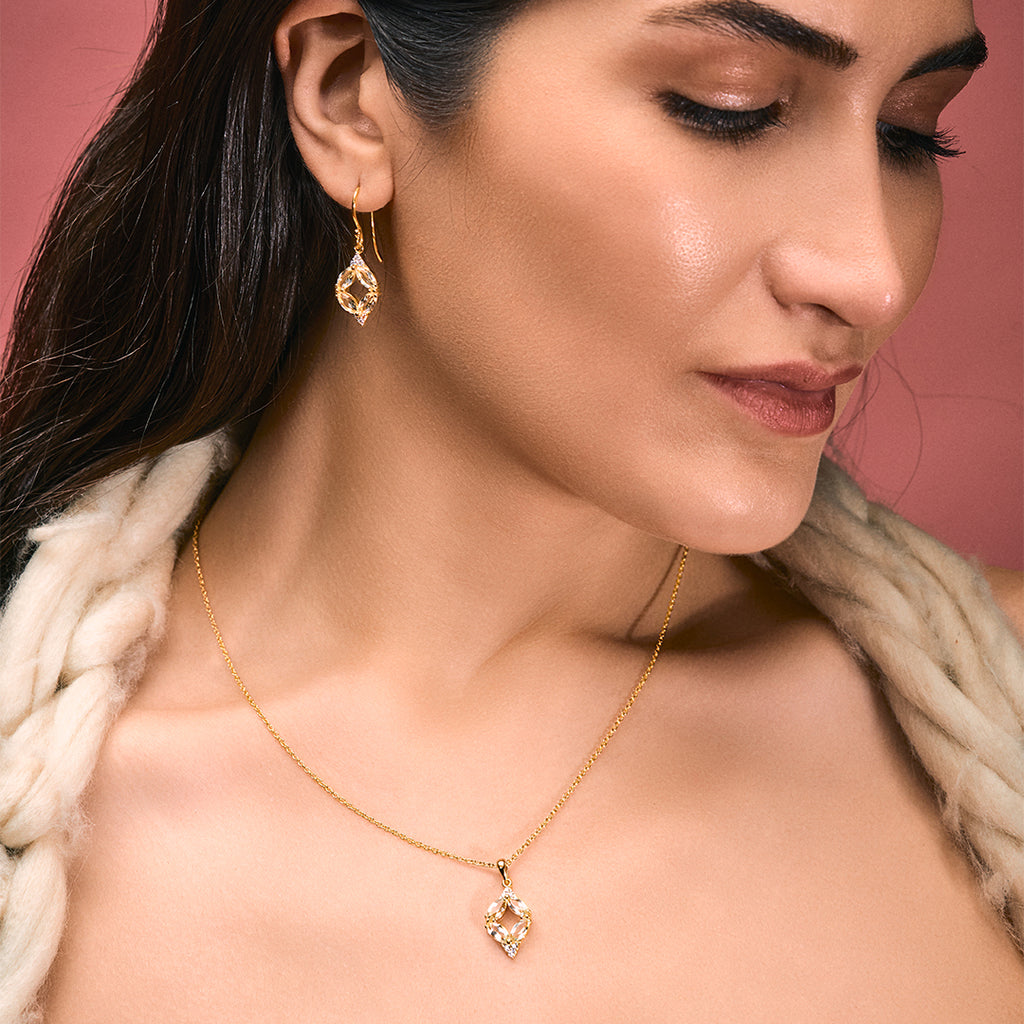 An image of Whispering Leaves Green Amethyst Ensemble Pendant, Earring with 10gm Silver Bar MMTC PAMP Gift Hamper.