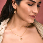 An image of Whispering Leaves Green Amethyst Ensemble Pendant, Earring with 10gm Silver Bar MMTC PAMP Gift Hamper.