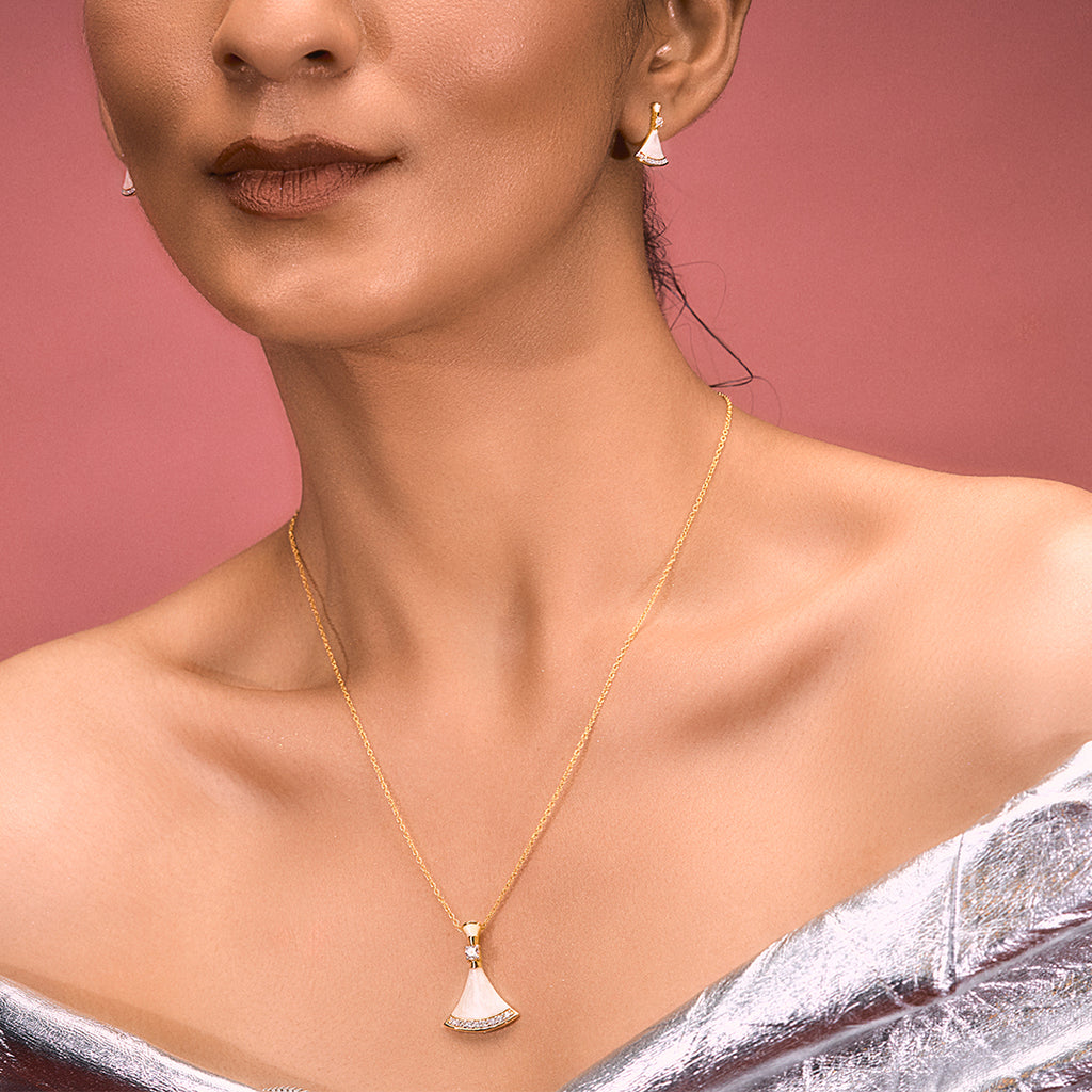 An image of Complete Ocean's Opulence Mother of Pearl Pendant, Earrings, Golden Chain with 10gm Silver Bar MMTC PAMP Gift Hamper.
