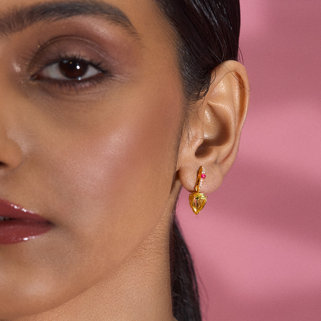 A woman wearing CHIVRI's Lemon and Pink Earrings with Cubic Zirconia.