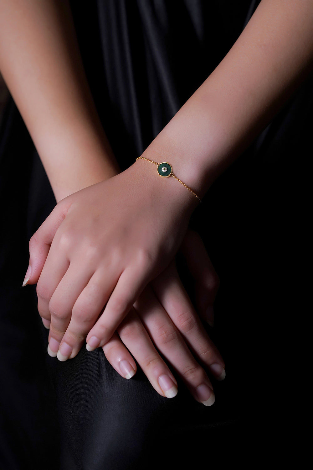 A woman wearing Lush Malchite Splendor Sparkling Cubic Zirconia Bracelets.