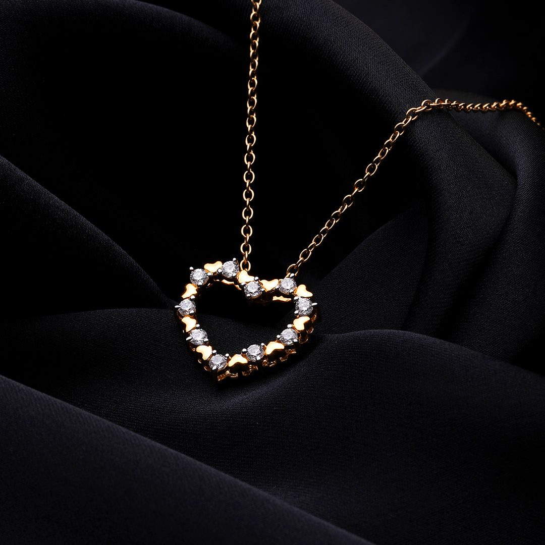 An image showing Dual Tone Heart Pendant in Gold and Silver Finish with Diamond Accents.