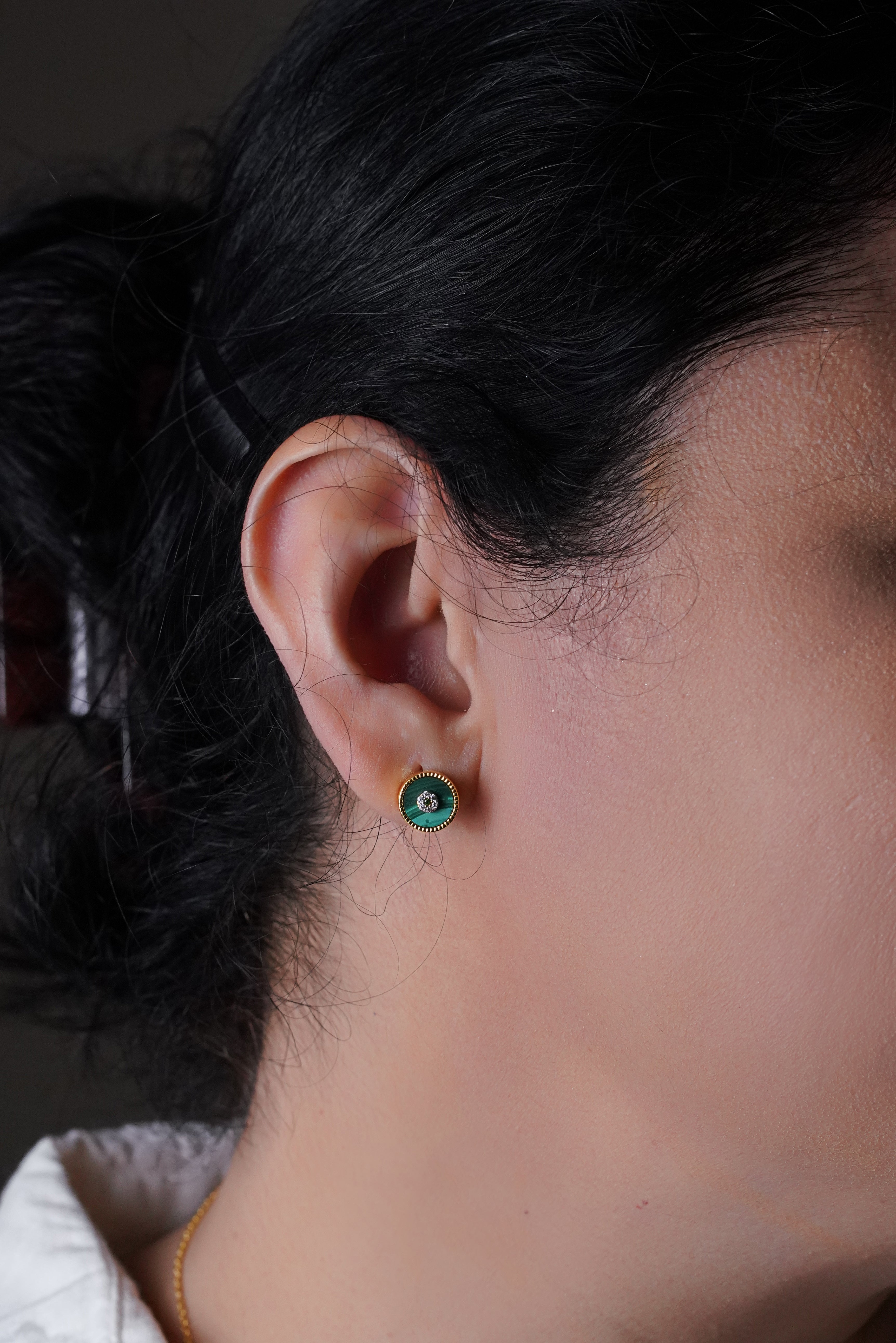 A woman wearing Lush Malchite Splendor Sparkling Cubic Zirconia Earrings.