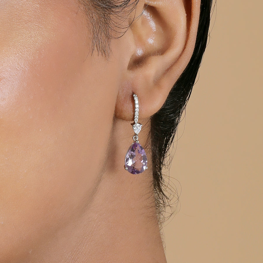  A woman wearing Lilac Amethyst Halo Silver Earrings.