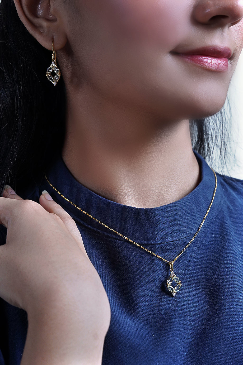 A woman wearing Gold Radiant Serenity Chain.