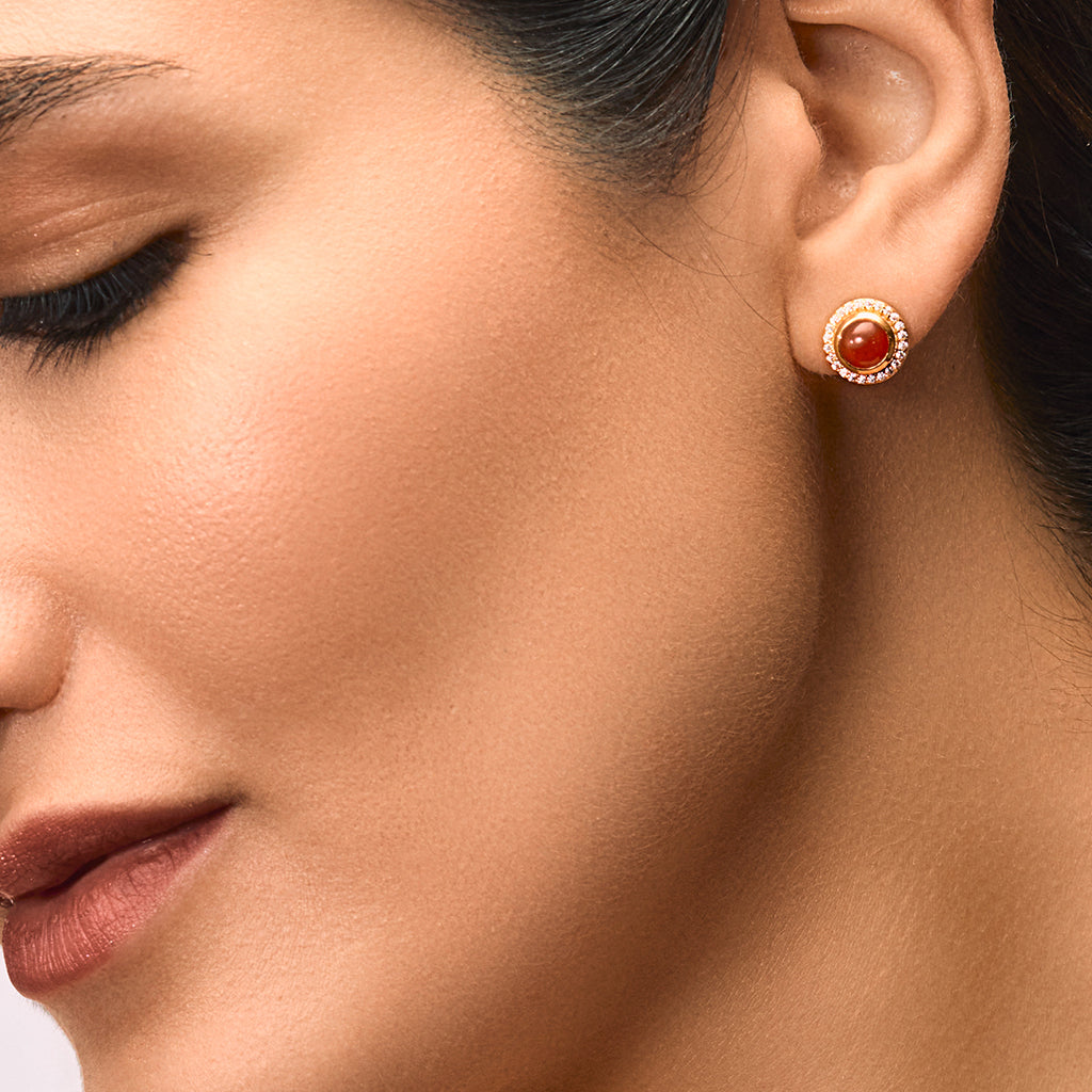 A woman wearing Red Onyx Tops with Sparkling Cubic Zirconia.