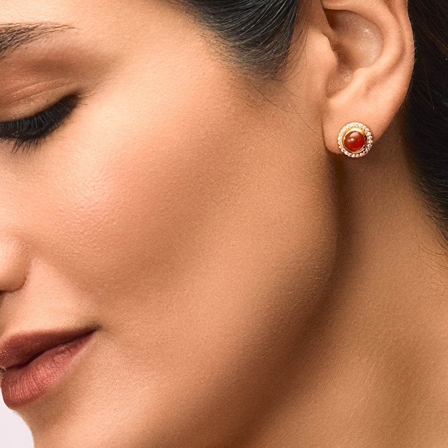 A woman wearing Red Onyx Tops with Sparkling Cubic Zirconia.