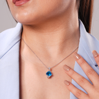 A woman wearing Blue Gem Pendant.