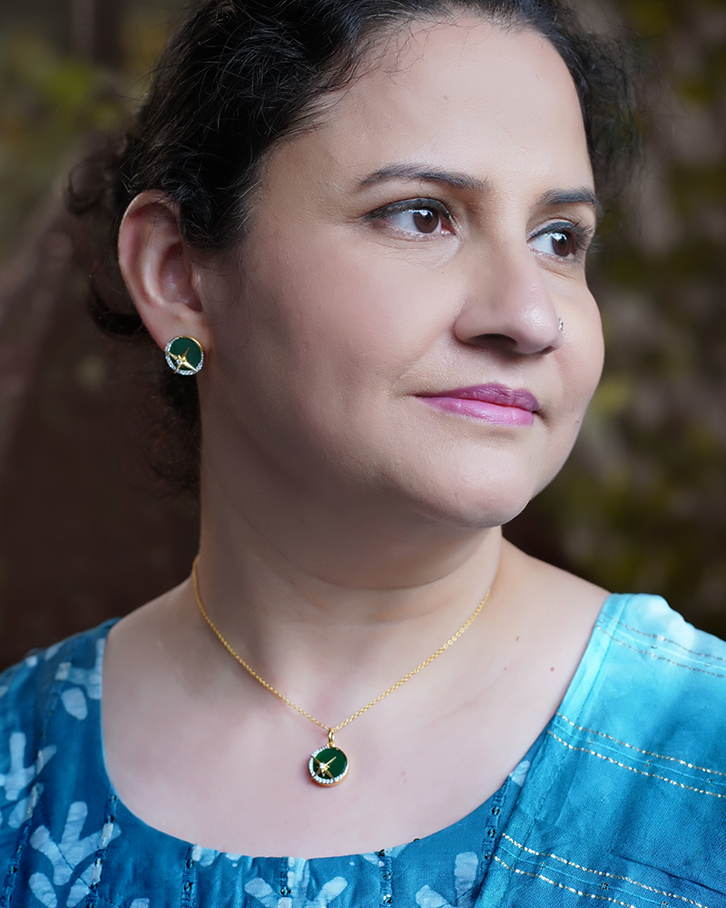 A woman wearing Luminous Galaxy Green Onyx Pendant Collection.