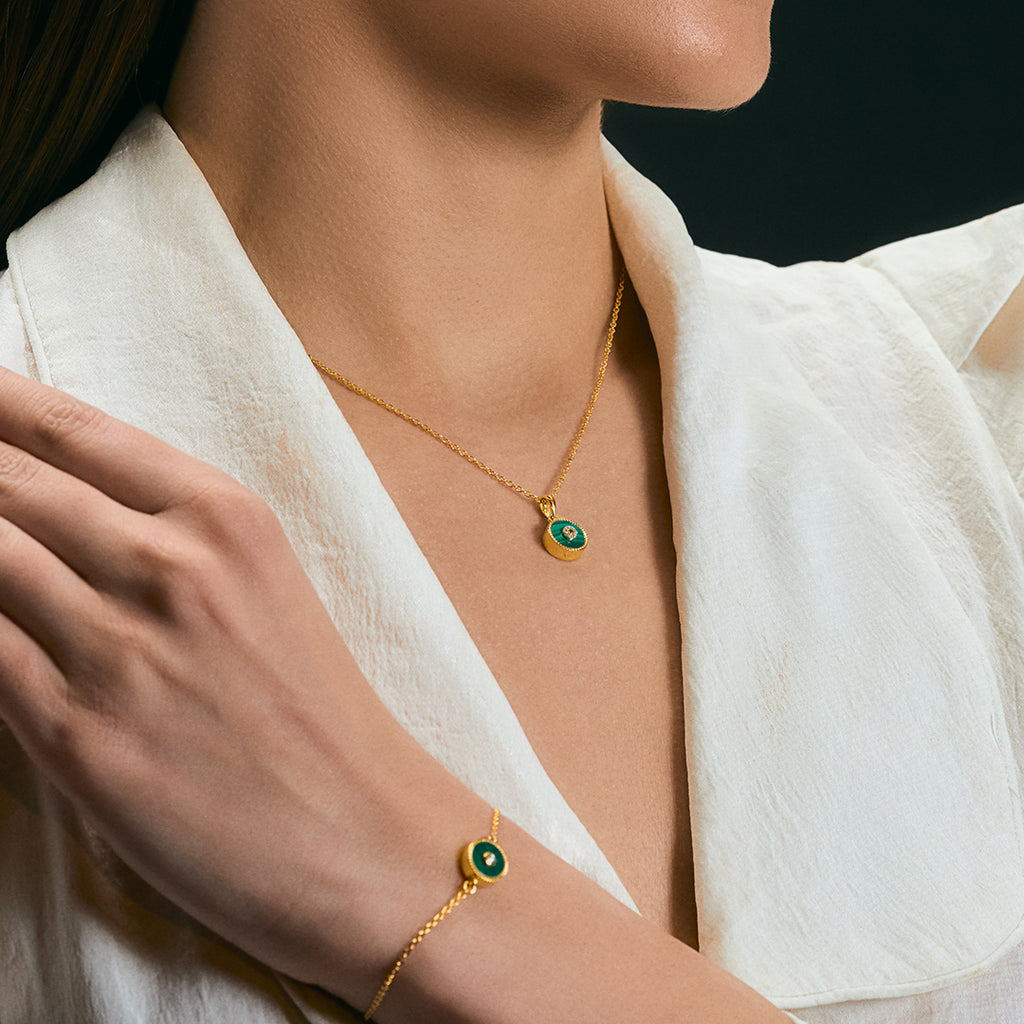 A woman wearing Lush Malachite Splendor Sparkling Cubic Zirconia Jewellery Set.